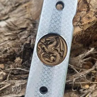 Incredibly detailed dragon-engraved 1911 grips